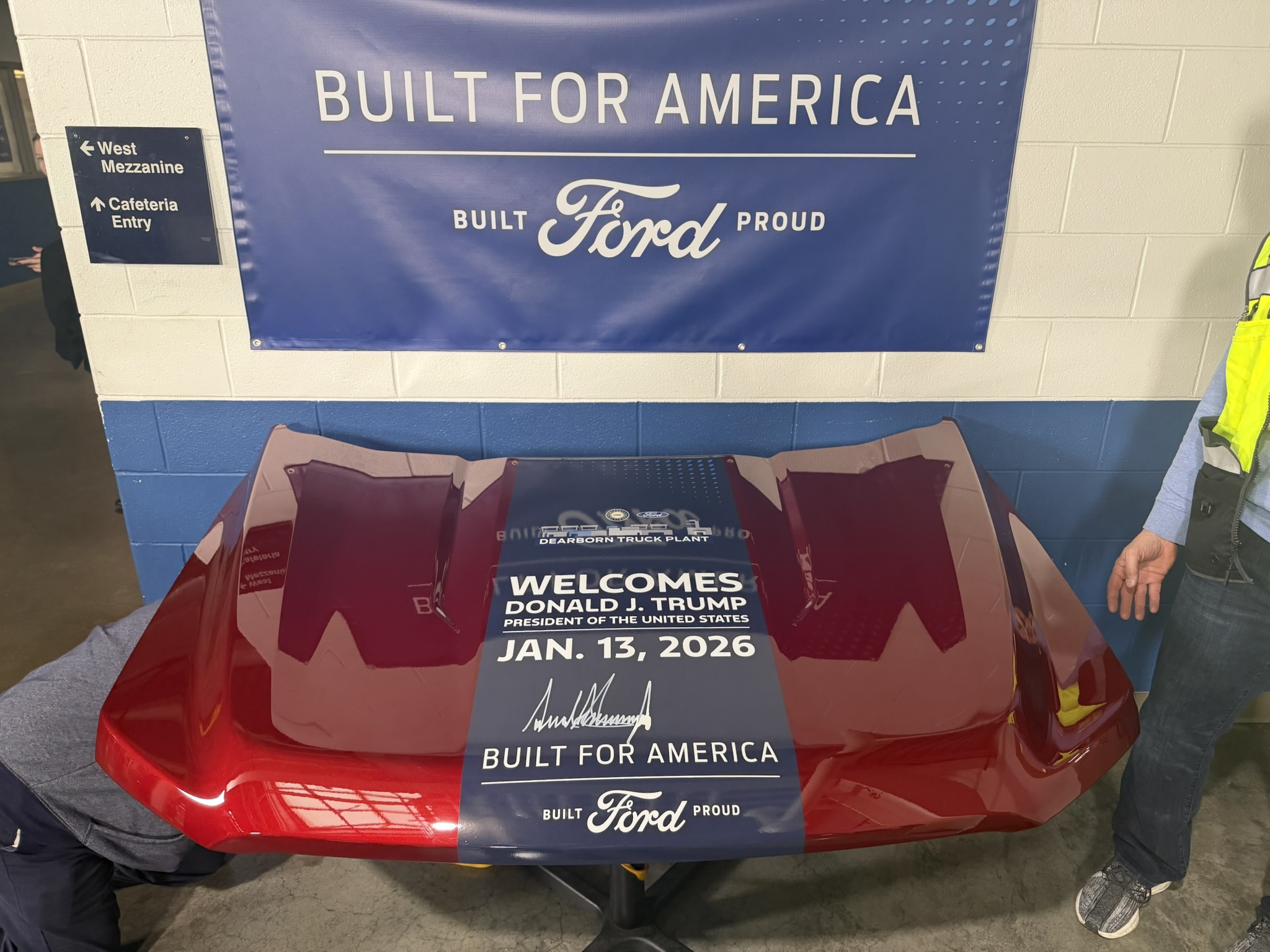 Red Ford hood with commemorative graphics for the presidential visit